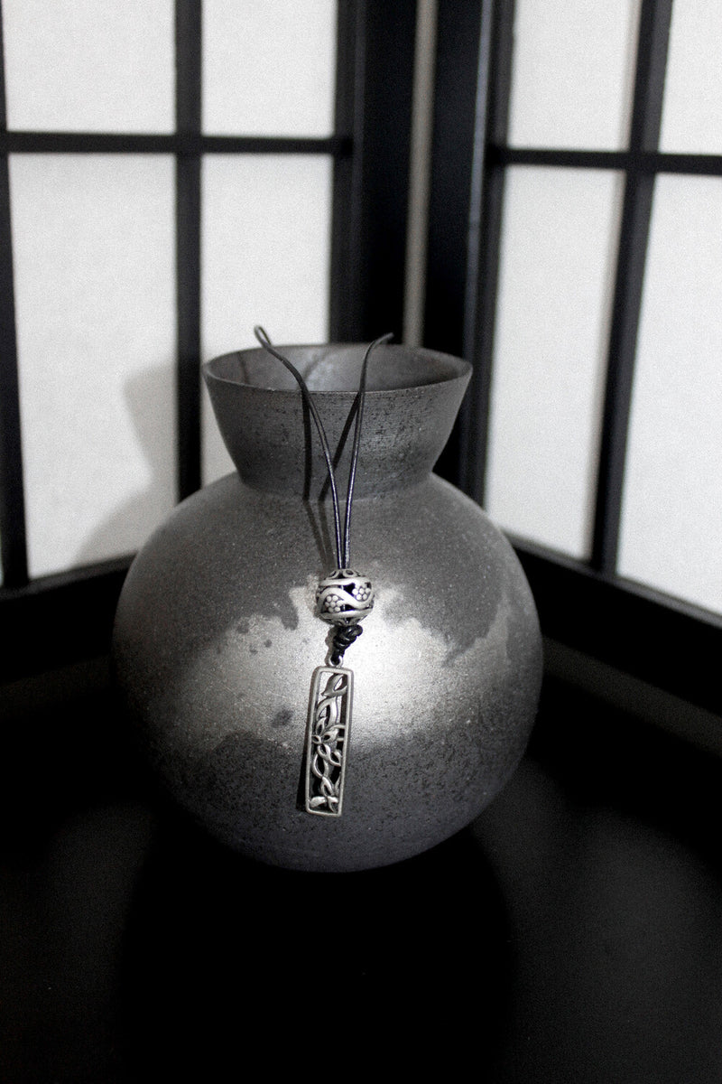 Wind bell necklace